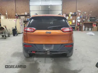 2014 Jeep Cherokee Trailhawk with VIN 1C4PJMBS0EW308775, listed as a Copart auction lot 60465125 with 117,326 mi miles and Salvage title. Bid and sale history available at DreamBid. Image 6.