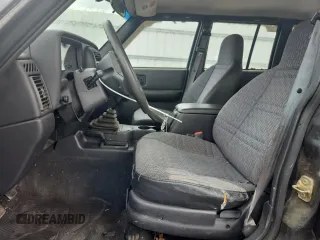 1999 Jeep Cherokee z VIN 1J4FF28P4XL560533, wystawiony jako Copart lot #59180605 z przebiegiem 190 262 mil mil oraz Czysty tytuł • Clean title. Historia ofert i sprzedaży dostępna na DreamBid. Obrazek 7.