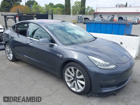 2018 Tesla Model 3 Long Range Battery with VIN 5YJ3E1EA8JF059385, listed as a IAAI auction lot 42116589 with 63,630 mi miles and . Bid and sale history available at DreamBid. Image 1.