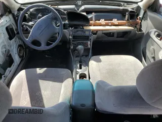 2001 Kia Sephia z VIN KNAFB121115074609, wystawiony jako Copart lot #72346144 z przebiegiem 88 400 mil mil oraz Tytuł czysty. Historia ofert i sprzedaży dostępna na DreamBid. Obrazek 8.