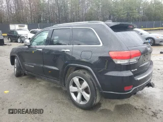 2014 Jeep Grand Cherokee Overland with VIN 1C4RJFCG1EC587458, listed as a Copart auction lot 50213015 with 124,266 mi miles and Salvage Title. Bid and sale history available at carsss.com. Image 2.