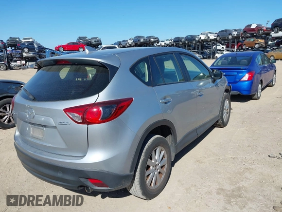 2016 Mazda CX-5 Sport with VIN JM3KE2BE9G0915168, listed as a IAAI auction lot 41482749 with 86,802 mi miles and . Bid and sale history available at carsss.com. Image 4.