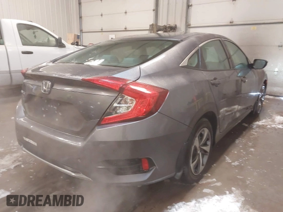 2020 Honda Civic LX z VIN 19XFC2F65LE030888, wystawiony jako IAAI lot #41609630 z przebiegiem 115 614 mil mil oraz . Historia ofert i sprzedaży dostępna na DreamBid. Obrazek 4.
