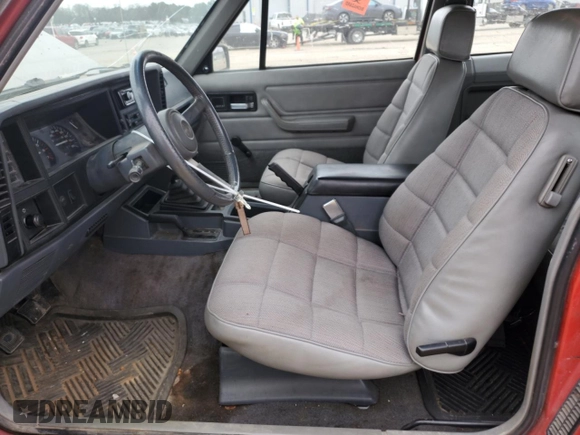 1993 Jeep Cherokee Sport with VIN 1J4FJ67S6PL580133, listed as a Copart auction lot 43230005 with 122,173 mi miles and Salvage Title. Bid and sale history available at carsss.com. Image 7.