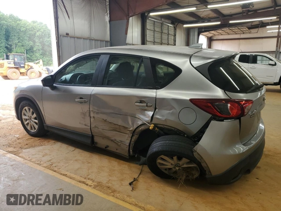 2013 Mazda CX-5 Sport with VIN JM3KE2BE6D0110272, listed as a Copart auction lot 57570725 with 124,475 mi miles and Salvage title. Bid and sale history available at DreamBid. Image 2.