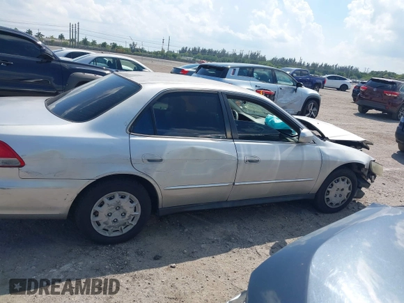 2002 Honda Accord LX z VIN JHMCG56462C005400, wystawiony jako IAAI lot #41893400 z przebiegiem Nie podano mil oraz . Historia ofert i sprzedaży dostępna na DreamBid. Obrazek 14.