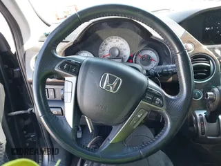 2014 Honda Pilot Touring with VIN 5FNYF4H94EB049495, listed as a IAAI auction lot 41937134 with 149,445 mi miles and . Bid and sale history available at carsss.com. Image 12.