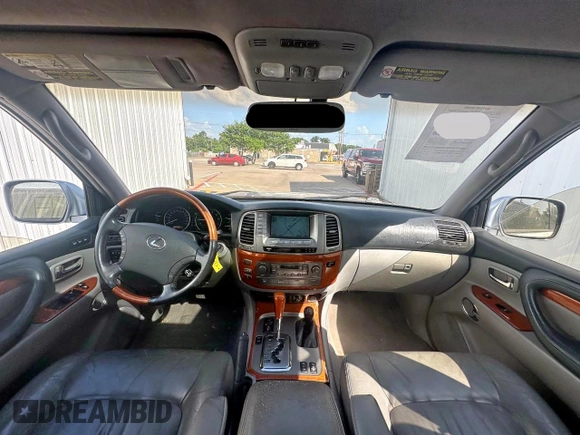 2003 Lexus LX 470 z VIN JTJHT00W933535214, wystawiony jako Copart lot #62037495 z przebiegiem 373 210 mil mil oraz Czysty tytuł • Clean title. Historia ofert i sprzedaży dostępna na DreamBid. Obrazek 9.