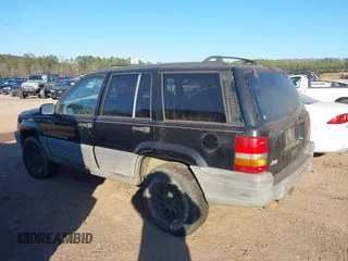 1998 Jeep Grand Cherokee Laredo with VIN 1J4FX58S7WC283734, listed as a IAAI auction lot 41267813 with 266,189 mi miles. Bid and sale history available at carsss.com. Image 6.