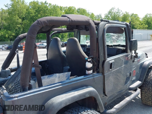 2001 Jeep Wrangler Sport z VIN 1J4FA49S11P322636, wystawiony jako IAAI lot #42409917 z przebiegiem 88 675 mil mil oraz . Historia ofert i sprzedaży dostępna na DreamBid. Obrazek 13.