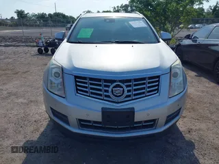 2014 Cadillac SRX Luxury Collection z VIN 3GYFNEE36ES652353, wystawiony jako IAAI lot #42233986 z przebiegiem 146 029 mil mil oraz . Historia ofert i sprzedaży dostępna na DreamBid. Obrazek 12.