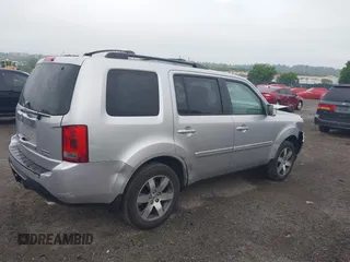 2013 Honda Pilot Touring z VIN 5FNYF4H96DB051005, wystawiony jako IAAI lot #42211189 z przebiegiem 215 594 mil mil oraz . Historia ofert i sprzedaży dostępna na DreamBid. Obrazek 4.