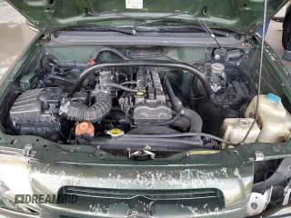 2000 Suzuki Vitara JLS z VIN 2S3TE52VXY6110157, wystawiony jako Copart lot #79173714 z przebiegiem 165 283 mil mil oraz Nie do naprawy. Historia ofert i sprzedaży dostępna na DreamBid. Obrazek 11.