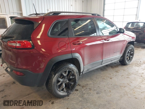 2016 Jeep Cherokee Trailhawk with VIN 1C4PJMBBXGW135138, listed as a IAAI auction lot 41595718 with 267,058 mi miles and . Bid and sale history available at DreamBid. Image 4.