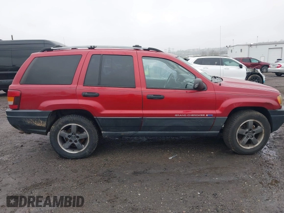 2004 Jeep Grand Cherokee Laredo with VIN 1J4GW48S94C151816, listed as a IAAI auction lot 41983332 with 151,227 mi miles. Bid and sale history available at carsss.com. Image 13.