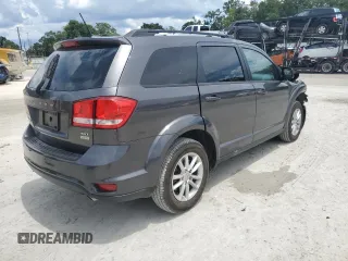 2017 Dodge Journey SXT z VIN 3C4PDCBG9HT515799, wystawiony jako Copart lot #62827975 z przebiegiem 156 215 mil mil oraz Szkoda całkowita • Salvage title. Historia ofert i sprzedaży dostępna na DreamBid. Obrazek 3.
