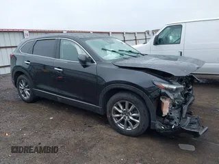 2019 Mazda CX-9 Touring z VIN JM3TCBCY6K0300248, wystawiony jako IAAI lot #42310992 z przebiegiem 112 707 mil mil oraz . Historia ofert i sprzedaży dostępna na DreamBid. Obrazek 1.