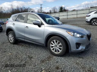 2014 Mazda CX-5 Touring with VIN JM3KE4CY4E0427294, listed as a Copart auction lot 51372155 with 121,324 mi miles and Salvage Title. Bid and sale history available at carsss.com. Image 4.
