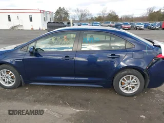 2021 Toyota Corolla Hybrid LE with VIN JTDEAMDE9MJ021431, listed as a IAAI auction lot 41747142 with 165,680 mi miles. Bid and sale history available at carsss.com. Image 14.