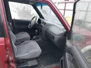 1996 Suzuki Sidekick z VIN JS3TD21V0T4107927, wystawiony jako IAAI lot #41249522 z przebiegiem 225 665 mil mil oraz . Historia ofert i sprzedaży dostępna na DreamBid. Obrazek 5.