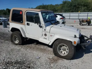 2000 Jeep Wrangler Sahara with VIN 1J4FA59SXYP764539, listed as a Copart auction lot 52707385 with 136,159 mi miles and Salvage title. Bid and sale history available at DreamBid. Image 4.