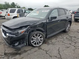 2020 Mazda CX-5 Grand Touring with VIN JM3KFBDMXL0784179, listed as a Copart auction lot 64937495 with 75,489 mi miles and Salvage title. Bid and sale history available at DreamBid. Image 1.