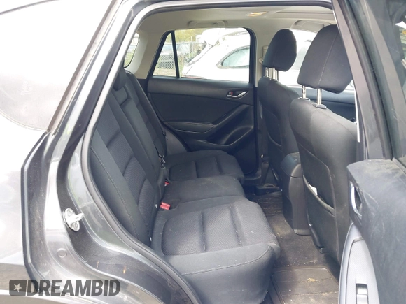 2016 Mazda CX-5 Touring with VIN JM3KE2CYXG0647921, listed as a IAAI auction lot 41948068 with 133,733 mi miles and . Bid and sale history available at DreamBid. Image 8.