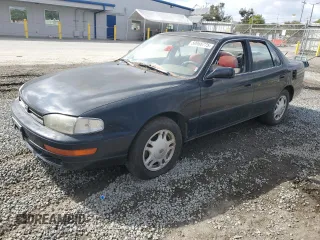 1994 Toyota Camry XLE with VIN JT2GK13E0R0012242, listed as a Copart auction lot 50966775 with 70,922 mi miles and Salvage Title. Bid and sale history available at carsss.com. Image 1.