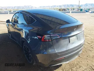 2022 Tesla Model Y Long Range with VIN 7SAYGDEE2NA017434, listed as a IAAI auction lot 41842025 with 35,164 mi miles and . Bid and sale history available at DreamBid. Image 3.