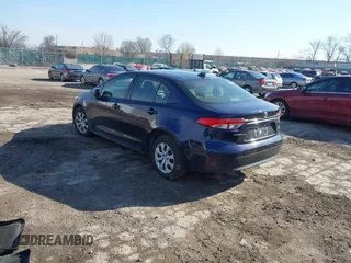 2023 Toyota Corolla Hybrid LE with VIN JTDBCMFE7PJ005985, listed as a IAAI auction lot 41574856 with 31,568 mi miles. Bid and sale history available at carsss.com. Image 3.