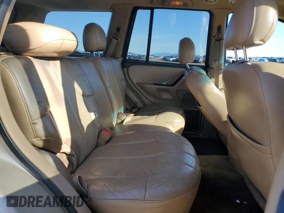 1999 Jeep Grand Cherokee Laredo z VIN 1J4GW58NXXC704719, wystawiony jako Copart lot #49546395 z przebiegiem 276 716 mil mil oraz Czysty tytuł • Clean title. Historia ofert i sprzedaży dostępna na DreamBid. Obrazek 11.