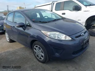 2013 Ford Fiesta SE with VIN 3FADP4EJ6DM205708, listed as a IAAI auction lot 42051721 with 139,143 mi miles. Bid and sale history available at carsss.com. Image 1.