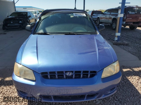 2002 Hyundai Accent GL with VIN KMHCG45C32U332833, listed as a Copart auction lot 66539644 with 69,763 mi miles and Salvage Title. Bid and sale history available at carsss.com. Image 5.