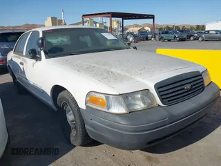 2000 Ford Crown Victoria Police Interceptor z VIN 2FAFP71W7YX104263, wystawiony jako IAAI lot #42442496 z przebiegiem 153 064 mil mil oraz . Historia ofert i sprzedaży dostępna na DreamBid. Obrazek 1.