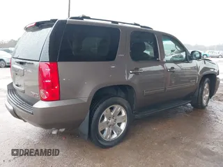 2014 GMC Yukon SLT with VIN 1GKS1CE00ER164663, listed as a IAAI auction lot 41547771 with 178,998 mi miles. Bid and sale history available at carsss.com. Image 4.