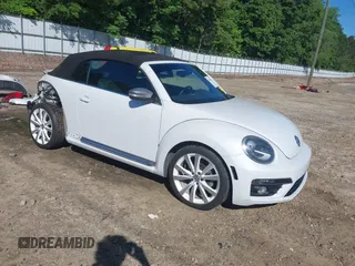 2014 Volkswagen Beetle 1.8T with VIN 3VW517AT6EM818323, listed as a IAAI auction lot 42163211 with 98,502 mi miles and . Bid and sale history available at DreamBid. Image 1.