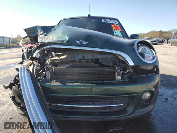 2015 MINI Convertible with VIN WMWZN3C53FT862148, listed as a Copart auction lot 76911714 with 56,065 mi miles and Salvage title. Bid and sale history available at DreamBid. Image 5.