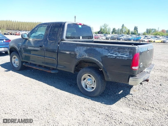 2000 Ford F-150 XL with VIN 1FTRX18L6YKB06492, listed as a IAAI auction lot 42058110 with 169,217 mi miles. Bid and sale history available at carsss.com. Image 3.