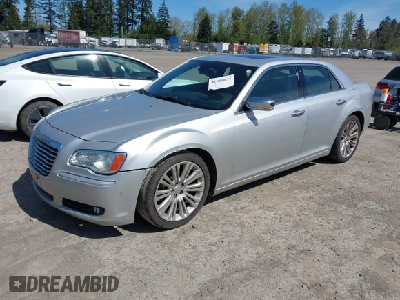 2012 Chrysler 300 with VIN 2C3CCAET2CH207796, listed as a IAAI auction lot 42029639 with 142,929 mi miles. Bid and sale history available at carsss.com. Image 2.
