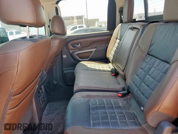 2017 Nissan Titan Pro-4X z VIN 1N6BA1F42HN575024, wystawiony jako Copart lot #52025835 z przebiegiem 23 422 mil mil oraz Czysty tytuł • Clean title. Historia ofert i sprzedaży dostępna na DreamBid. Obrazek 10.