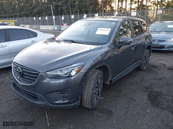 2016 Mazda CX-5 Grand Touring with VIN JM3KE4DY3G0817899, listed as a IAAI auction lot 41287459 with NaN miles. Bid and sale history available at carsss.com. Image 2.