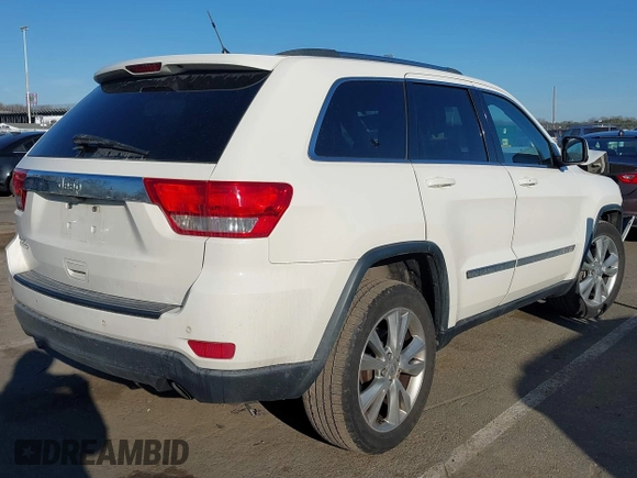 2012 Jeep Grand Cherokee Laredo with VIN 1C4RJFAG5CC310893, listed as a IAAI auction lot 41695279 with 136,821 mi miles. Bid and sale history available at carsss.com. Image 4.
