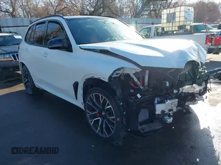 2022 BMW X5 M with VIN 5YMJU0C02N9K39077, listed as a IAAI auction lot 41711996 with 11,875 mi miles. Bid and sale history available at carsss.com. Image 1.