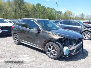 2016 BMW X1 xDrive28i with VIN WBXHT3C3XGP889833, listed as a IAAI auction lot 39118131 with 111,343 mi miles. Bid and sale history available at carsss.com. Image 1.