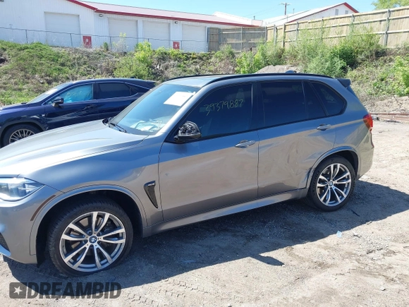 2014 BMW X5 xDrive50i with VIN 5UXKR6C57E0J72301, listed as a IAAI auction lot 39379887 with 117,012 mi miles. Bid and sale history available at carsss.com. Image 6.
