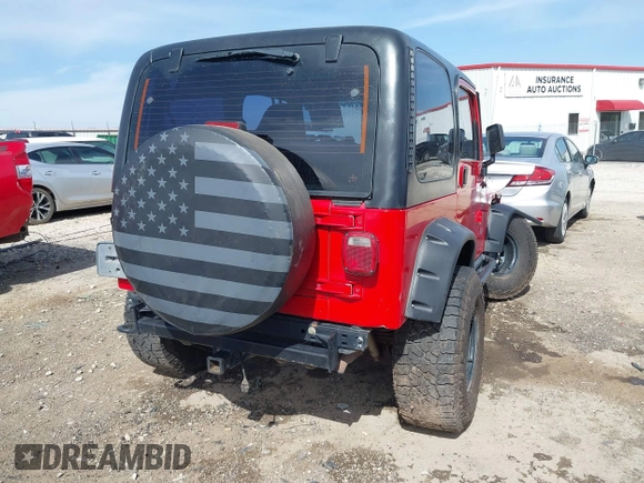 2002 Jeep Wrangler Sport with VIN 1J4FA49S42P771262, listed as a IAAI auction lot 41819403 with 132,871 mi miles. Bid and sale history available at carsss.com. Image 4.