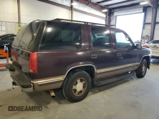 1997 GMC Yukon with VIN 1GKEC13R2VJ734299, listed as a Copart auction lot 74988224 with 225,335 mi miles and Salvage Title. Bid and sale history available at carsss.com. Image 3.