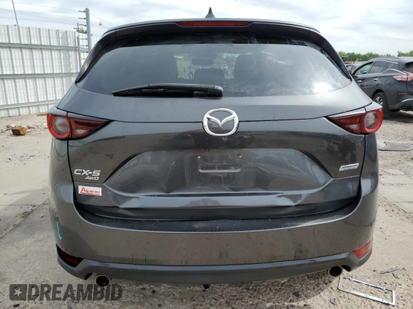 2018 Mazda CX-5 Touring z VIN JM3KFBCM2J0379190, wystawiony jako Copart lot #59233075 z przebiegiem 51 985 mil mil oraz Szkoda całkowita • Salvage title. Historia ofert i sprzedaży dostępna na DreamBid. Obrazek 6.