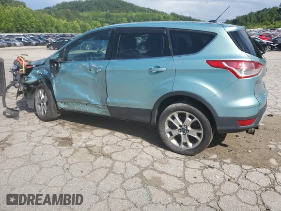 2013 Ford Escape SEL z VIN 1FMCU9H98DUC56048, wystawiony jako Copart lot #61613085 z przebiegiem 198 102 mil mil oraz Szkoda całkowita • Salvage title. Historia ofert i sprzedaży dostępna na DreamBid. Obrazek 2.