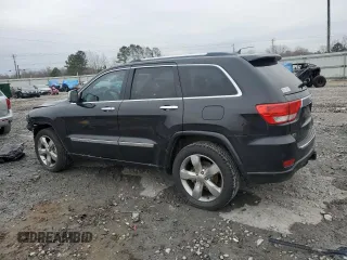 2013 Jeep Grand Cherokee Overland with VIN 1C4RJECG1DC546398, listed as a Copart auction lot 45834595 with 214,975 mi miles and Salvage Title. Bid and sale history available at carsss.com. Image 2.